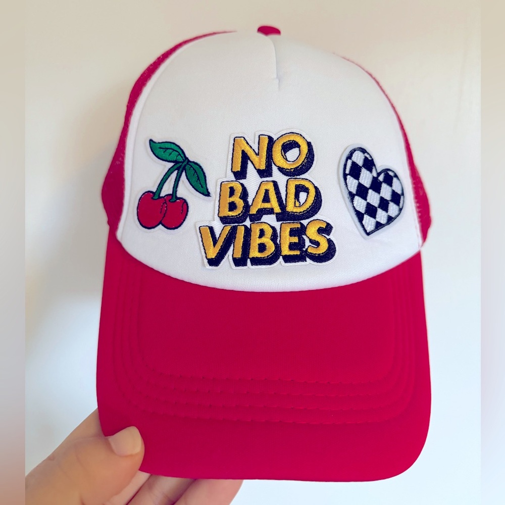 Red snapback trucker hat with patches